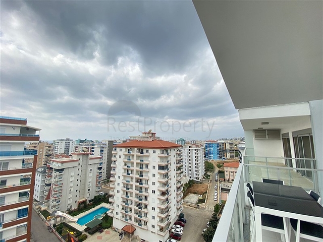 شقة واسعة غرفتين وصالة -ضمن مجمع حديث - في محمودلار/ الانيا 