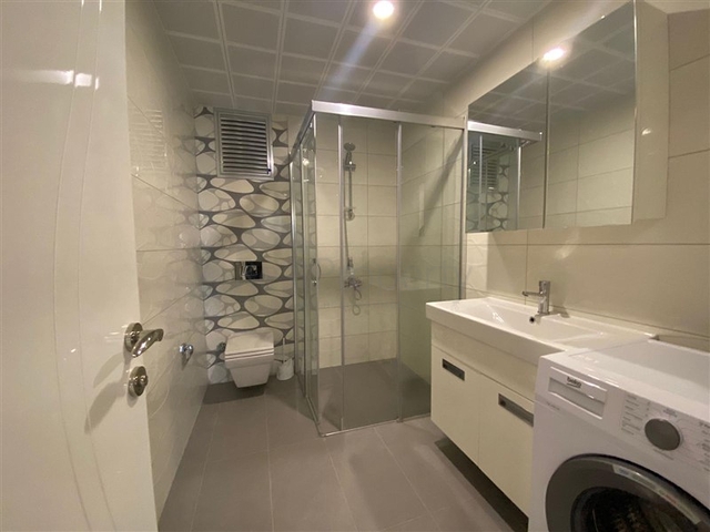 شقة واسعة غرفتين وصالة -ضمن مجمع حديث - في محمودلار/ الانيا 