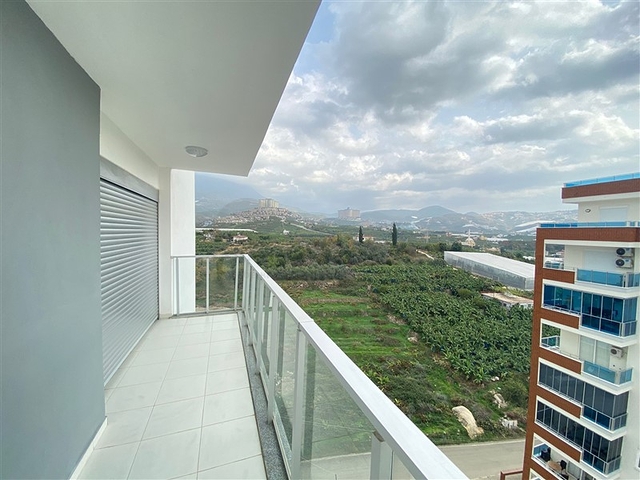 شقة واسعة غرفتين وصالة -ضمن مجمع حديث - في محمودلار/ الانيا 