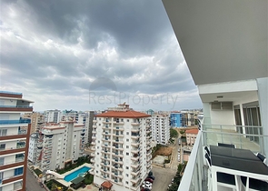 شقة واسعة غرفتين وصالة -ضمن مجمع حديث - في محمودلار/ الانيا 