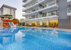 شقة واسعة غرفتين وصالة -ضمن مجمع حديث - في محمودلار/ الانيا 