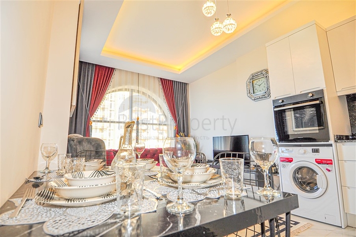 شقق اطلالة على البحر في الانيا - تصميم غرفة وصالة مفروشة - في كارجيجاك / الانيا 