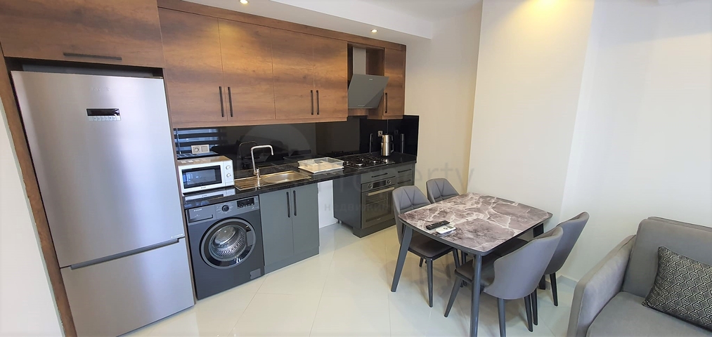 شقة غرفة وصالة ضمن مجمع 5 نجوم -في محمودلار / الانيا 