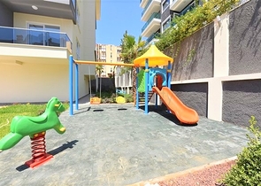 شقة غرفة وصالة ضمن مجمع حديث -قريب من البحر والخدمات -في افسلار / الانيا 