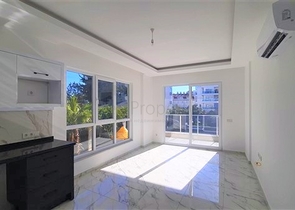 شقة غرفة وصالة ضمن مجمع حديث -قريب من البحر والخدمات -في افسلار / الانيا 