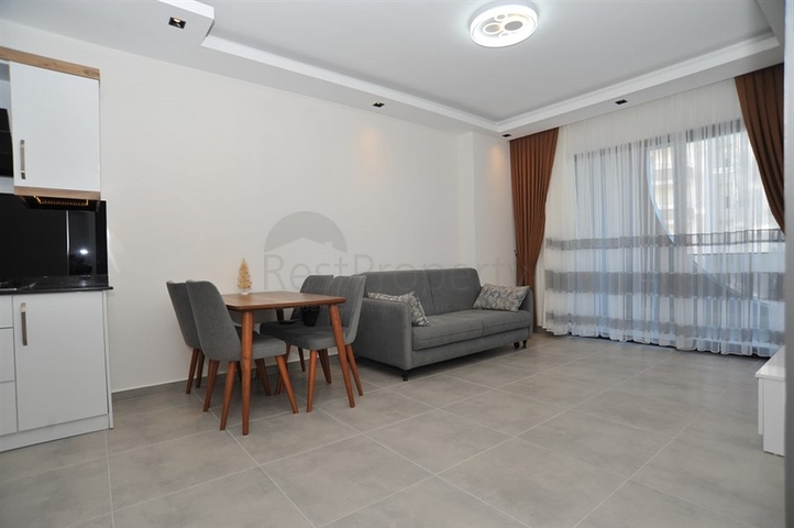 شقة غرفة وصالة -ضمن مجمع سكني حديث - في محمودلار / الانيا 