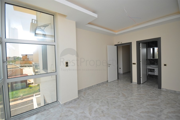 جانب المشفى الحكومي في الانيا - شقة 2 غرفة وصالة ضمن مجمع حديث في اوبا / الانيا 