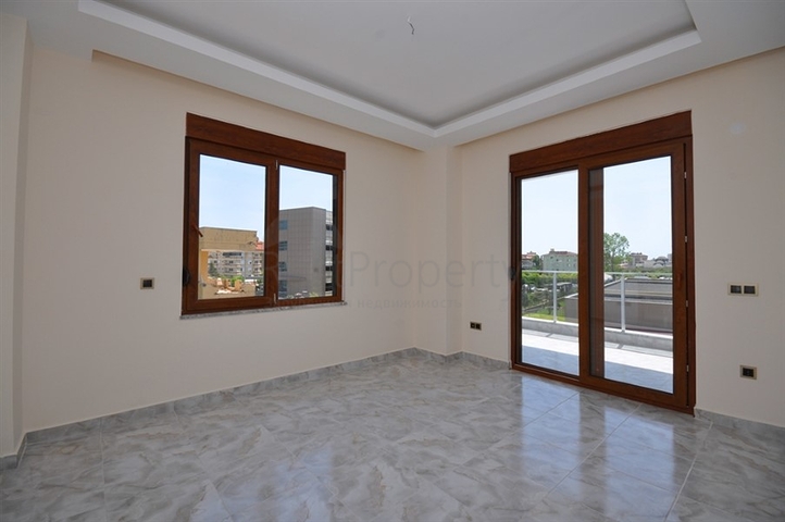 جانب المشفى الحكومي في الانيا - شقة 2 غرفة وصالة ضمن مجمع حديث في اوبا / الانيا 