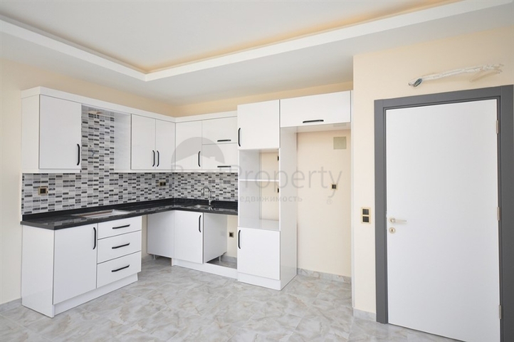 جانب المشفى الحكومي في الانيا - شقة 2 غرفة وصالة ضمن مجمع حديث في اوبا / الانيا 