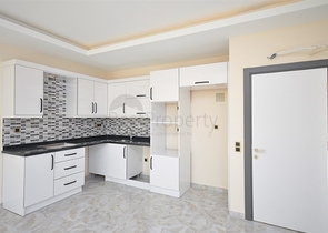 جانب المشفى الحكومي في الانيا - شقة 2 غرفة وصالة ضمن مجمع حديث في اوبا / الانيا 