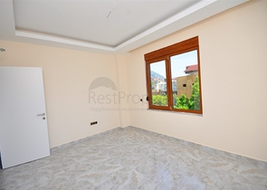 جانب المشفى الحكومي في الانيا - شقة 2 غرفة وصالة ضمن مجمع حديث في اوبا / الانيا 