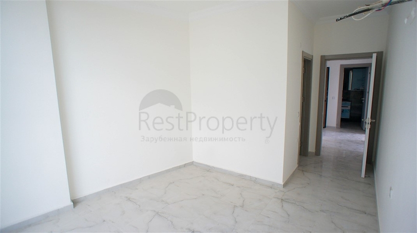 شقة غرفتين وصالة -مجمع حديث - في محمودلار/ الانيا 