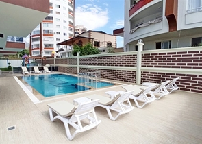 شقة غرفة وصالة ضمن مجمع جديد - في محمودلار / الانيا 