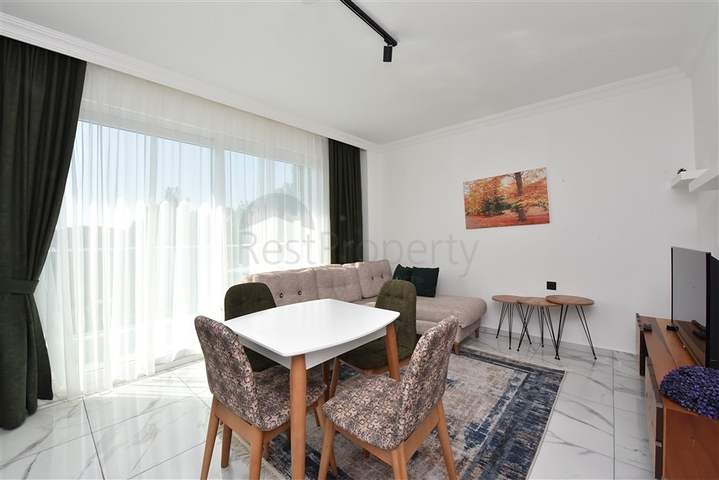 سعر اقتصادي - شقة مفروشة من تصميم غرفة نوم وصالة ضمن مجمع - في افسلار / الانيا 