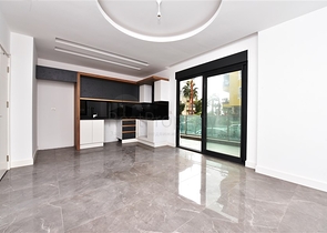 ضمن مجمع حديث في مركز الانيا - للبيع شقة غرفتين وصالة .