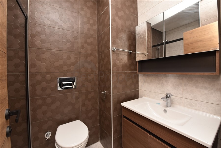 سعر مناسب - شقة غرفة وصالة جديدة -ضمن مجمع سكني في موقع ممتاز - اوبا / الانيا 