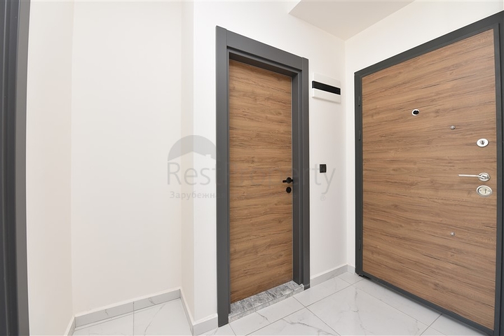 سعر مناسب - شقة غرفة وصالة جديدة -ضمن مجمع سكني في موقع ممتاز - اوبا / الانيا 