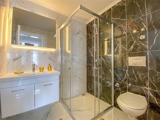 شقة زاوية - غرفتين وصالة مع مطبخ منفصل - مفروشة وضمن مجمع جديد - في ديمرتاش / الانيا 