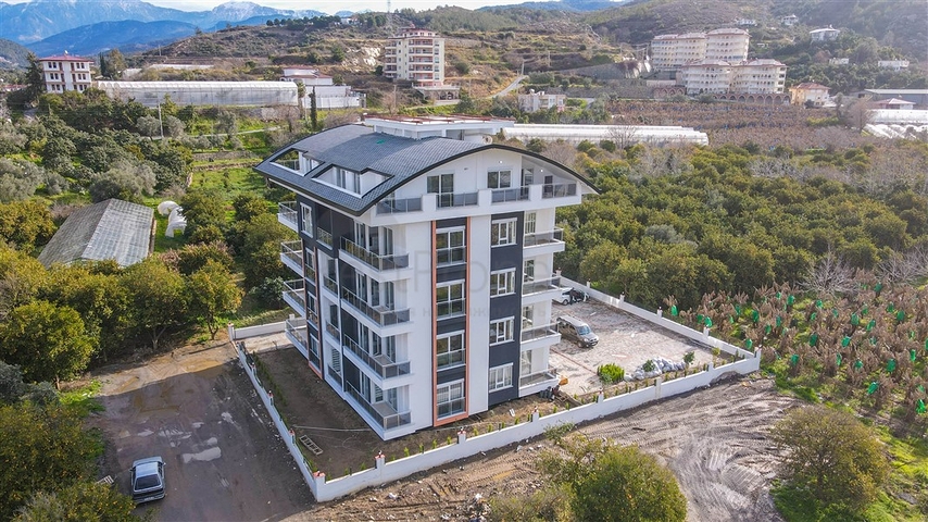 شقة زاوية - غرفتين وصالة مع مطبخ منفصل - مفروشة وضمن مجمع جديد - في ديمرتاش / الانيا 