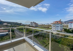 شقة زاوية - غرفتين وصالة مع مطبخ منفصل - مفروشة وضمن مجمع جديد - في ديمرتاش / الانيا 