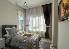 شقة زاوية - غرفتين وصالة مع مطبخ منفصل - مفروشة وضمن مجمع جديد - في ديمرتاش / الانيا 