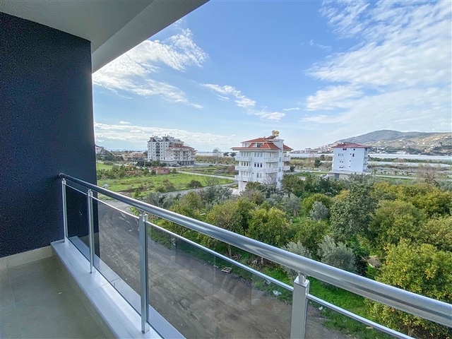 اطلالة على الطبيعة الخضراء - شقة انيقة ضمن مجمع جديد - تصميم غرفتين وصالة مع مطبخ منفصل - في ديمرتاش / الانيا 