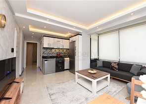 شقة جديدة - غرفة وصالة مفروشة -ضمن مجمع سكني في مركز الانيا 