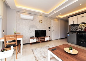 شقة جديدة - غرفة وصالة مفروشة -ضمن مجمع سكني في مركز الانيا 