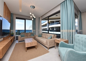 صف اول على البحر - شقة فاخرة غرفتين وصالة -ضمن مجمع 5 نجوم في كارجيجاك / الانيا 