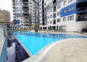 شقة غرفتين وصالة مفروشة -ضمن مجمع سكني حديث -في مركز الانيا 