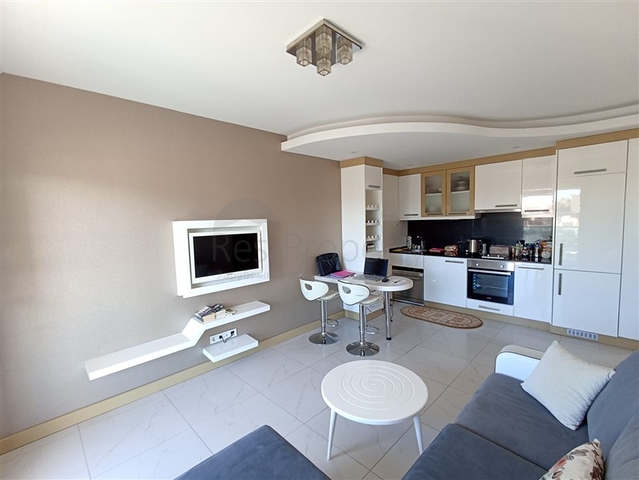 مناسبة للاستثمار - شقة غرفة وصالة مفروشة -ضمن مجمع يضم كافة الخدمات في مركز الانيا 