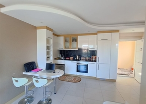 مناسبة للاستثمار - شقة غرفة وصالة مفروشة -ضمن مجمع يضم كافة الخدمات في مركز الانيا 