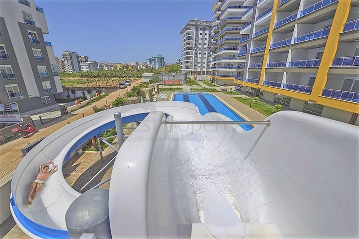 شقة غرفتين وصالة - مفروشة - ضمن مجمع يضم كافة الخدمات - في محمودلار / الانيا 