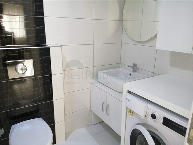 ضمن مجمع فاخر - شقة غرفتين وصالة مفروشة - مطبخ منفصل - في محمودلار / الانيا 