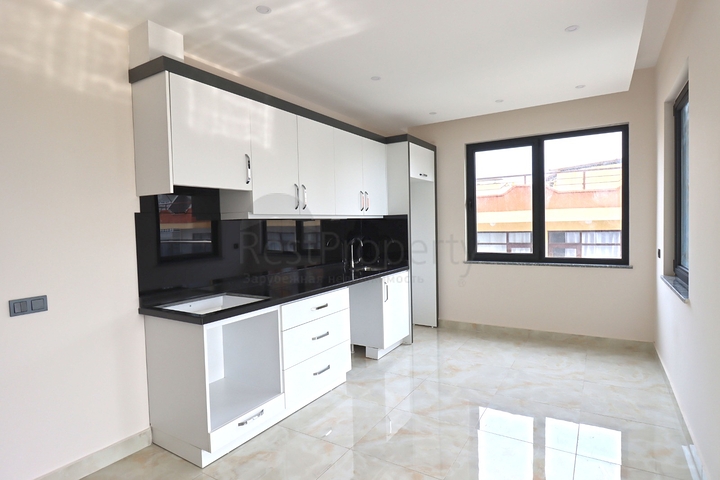 شقة غرفتين وصالة -ضمن مجمع جديد - في مركز الانيا 