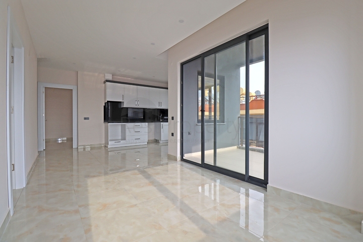 شقة غرفتين وصالة -ضمن مجمع جديد - في مركز الانيا 