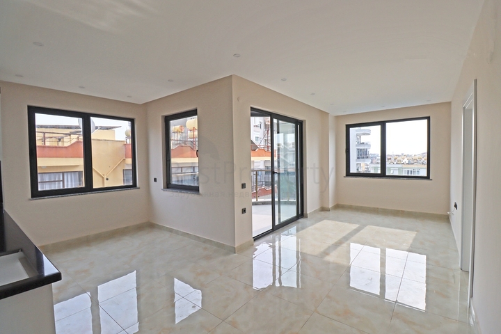 شقة غرفتين وصالة -ضمن مجمع جديد - في مركز الانيا 