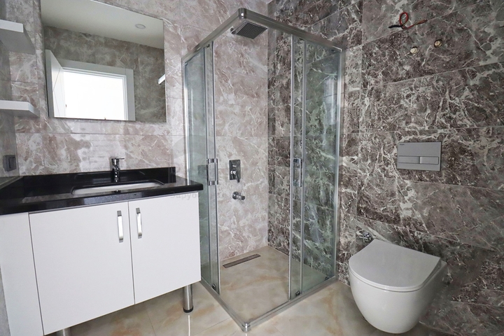 شقة غرفتين وصالة -ضمن مجمع جديد - في مركز الانيا 