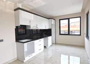 شقة غرفتين وصالة -ضمن مجمع جديد - في مركز الانيا 