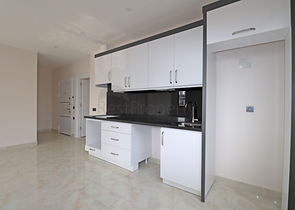 شقة غرفتين وصالة -ضمن مجمع جديد - في مركز الانيا 