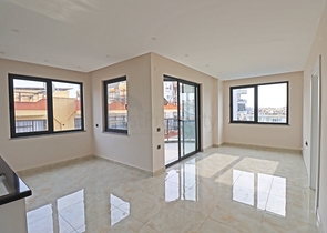 شقة غرفتين وصالة -ضمن مجمع جديد - في مركز الانيا 