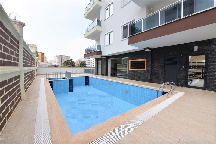 شقة غرفة وصالة - ضمن مجمع سكني جديد - في محمودلار / الانيا 