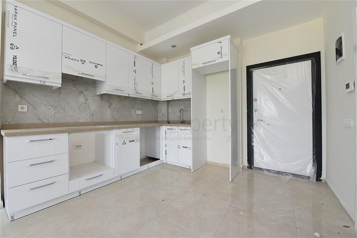 شقة ضمن مجمع يضم كافة الخدمات في افسلار / الانيا 