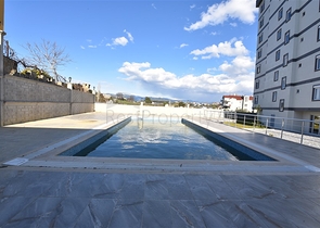 شقة ضمن مجمع يضم كافة الخدمات في افسلار / الانيا 