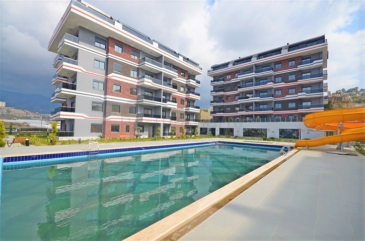 شقة غرفة وصالة - مجمع سكني انيق - في كارجيجاك / الانيا 