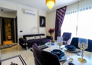 شقة جديدة - غرفة وصالة مفروشة بأناقة - ضمن مجمع في محمودلار/ الانيا