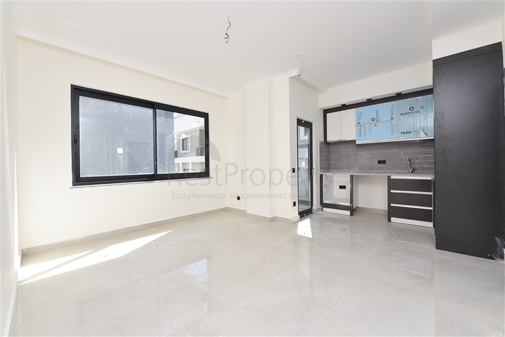 شقة جديدة - غرفة وصالة ضمن مجمع سكني - في محمودلار / الانيا 