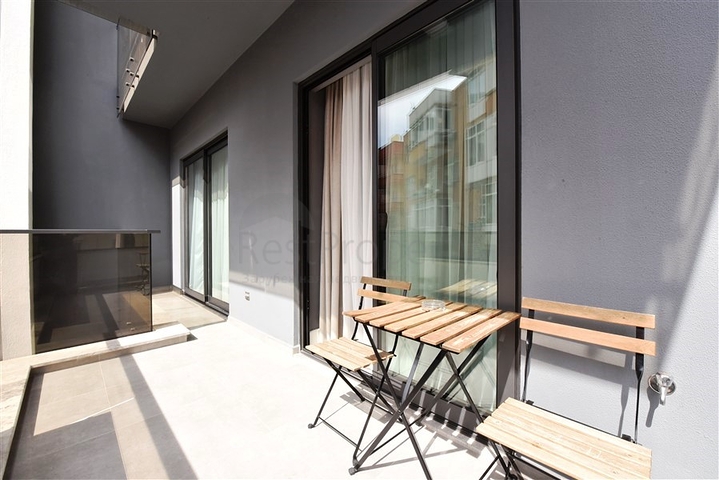 موقع مركزي - شقة غرفة وصالة مفروشة - ضمن مجمع حديث - في مركز الانيا 