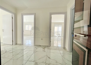 شقة جديدة - غرفتين وصالة - ضمن مجمع - في محمودلار / الانيا 