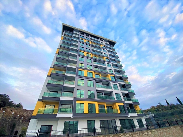 اطلالة على جبال طوروس - شقة غرفة وصالة - مجمع حديث - في محمودلار / الانيا 